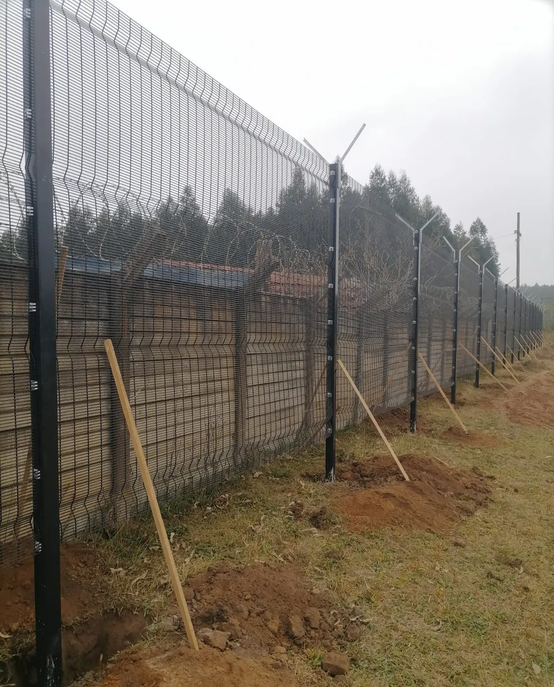Security mesh fence with razor wire built by Ngubane Contractors